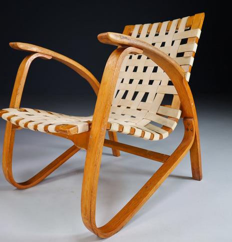 Patinated Lounge Chair in Wood and Canvas by Jan Vanek