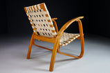 Patinated Lounge Chair in Wood and Canvas by Jan Vanek